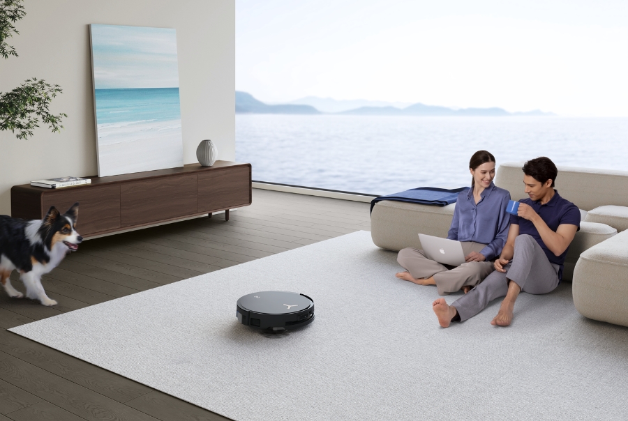 deebot robot vacuum cleaning carpet on its own