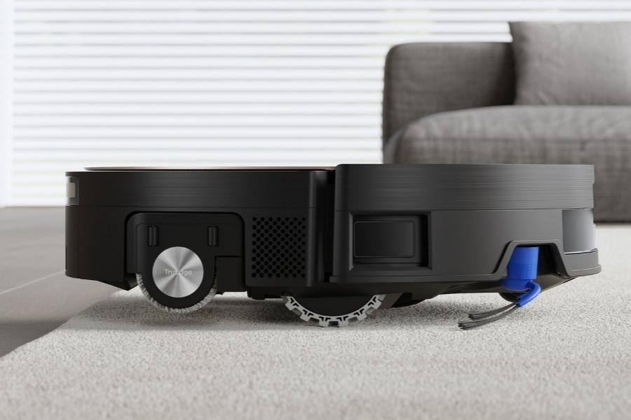 deebot robot vacuum cleaning a rug