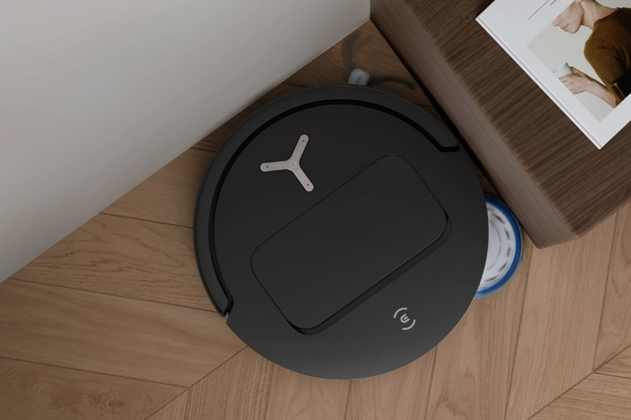 deebot robot vacuum cleaning kitchen corner