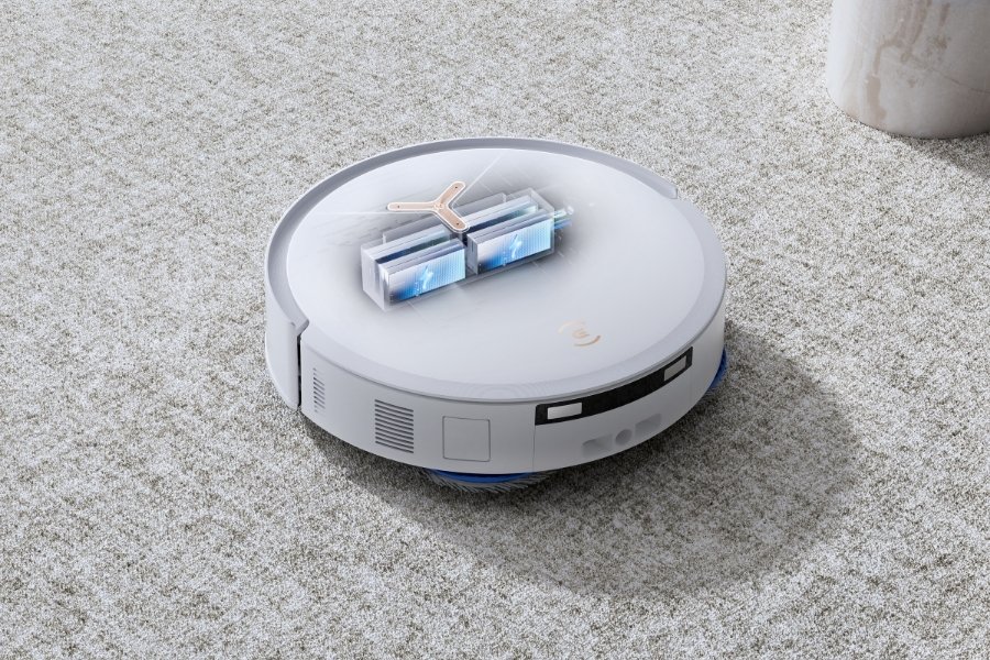 a close up of deebot robot vacuum lifting roller mop when cleaning carpet