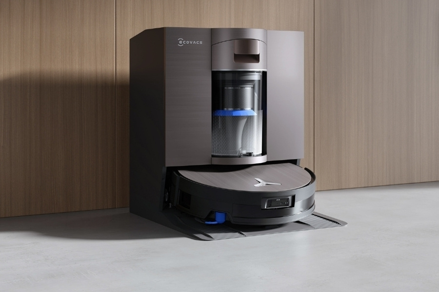 deebot robot vacuum charging at the station in the entry way marble floor