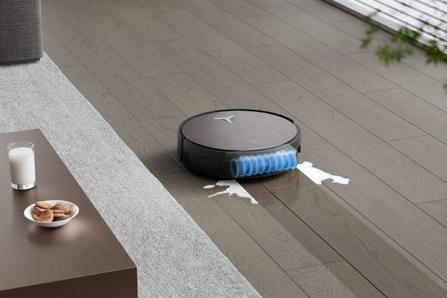 deebot robot vacuum mopping milk spills on laminate floor