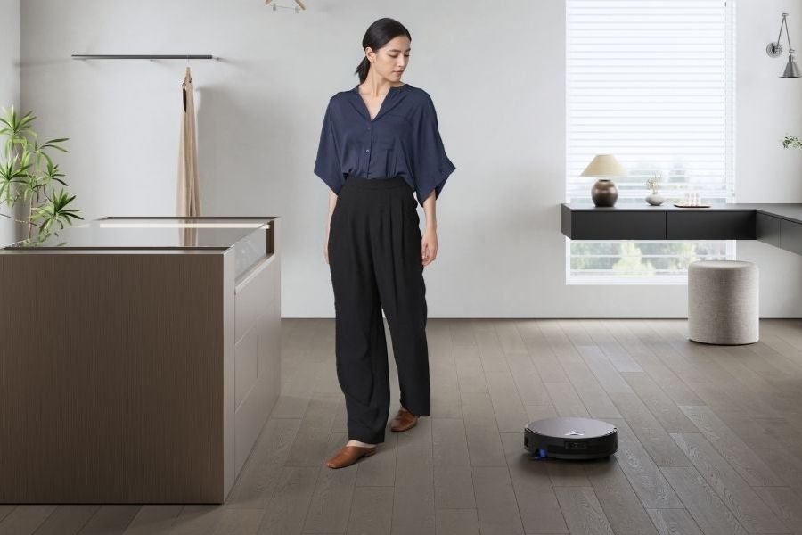 deebot robot vacuum mopping vinyl floors in the cloakroom