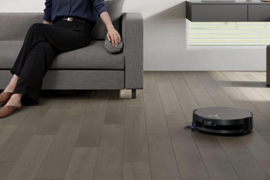 deebot robot vacuum cleaning cork floor in living room