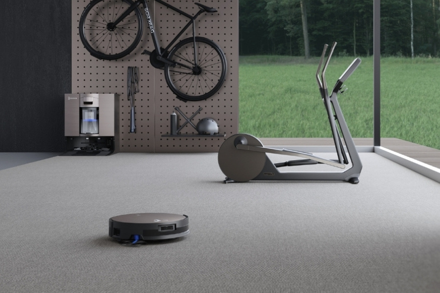 deebot robot vacuum cleaner in the gym
