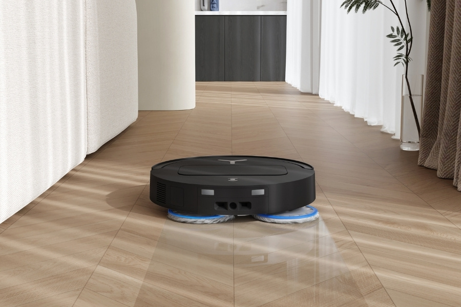 deebot robot vacuum and mop cleaner cleaning in the hallway