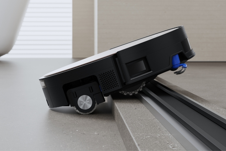 deeboto robot vacuum climbing a door sill