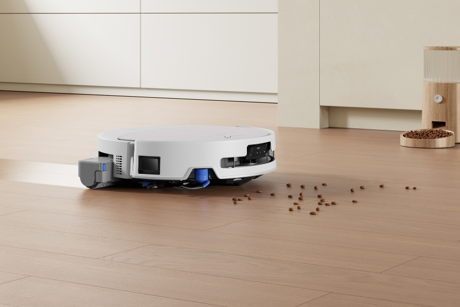 deebot robot vacuum lifting litter on the floor