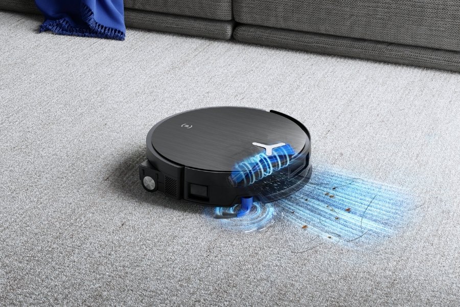 deebot robot vacuum cleaner lifting dirt and hair from the carpet with strong suction