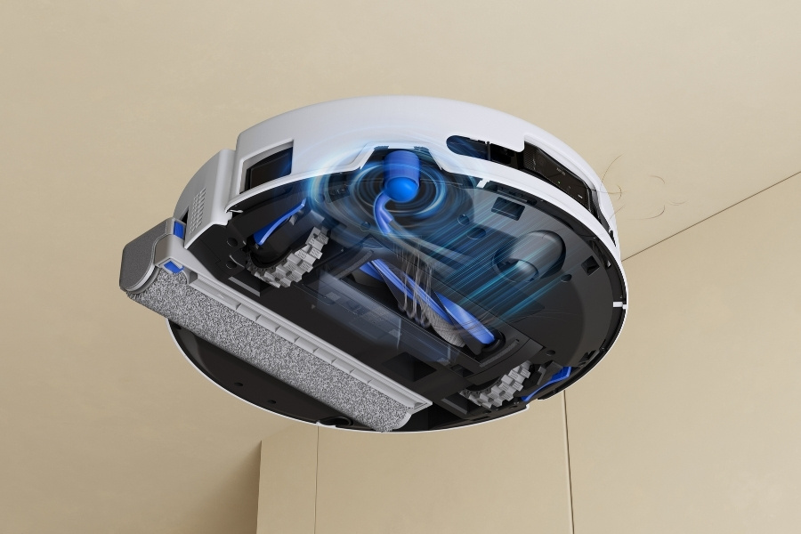 deebot robot vacuum picking up hair with zerotangle brushes