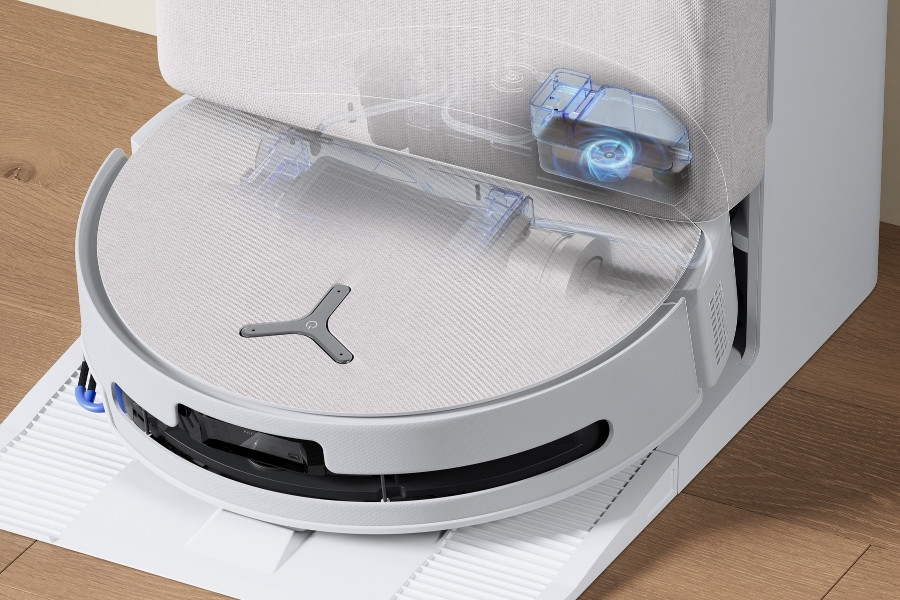 deebot robot vacuum cleaning the roller mop with fresh water at the station
