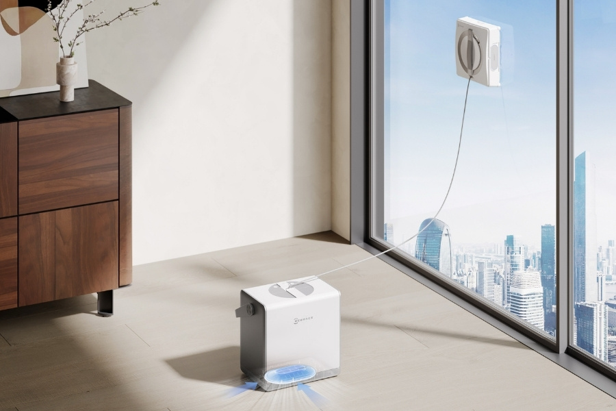 Winbot fensterputzroboter mit saugnapf an station am fenster