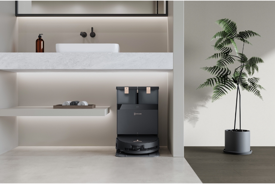 aspirateur robot Deebot sous un lavabo de salle de bain