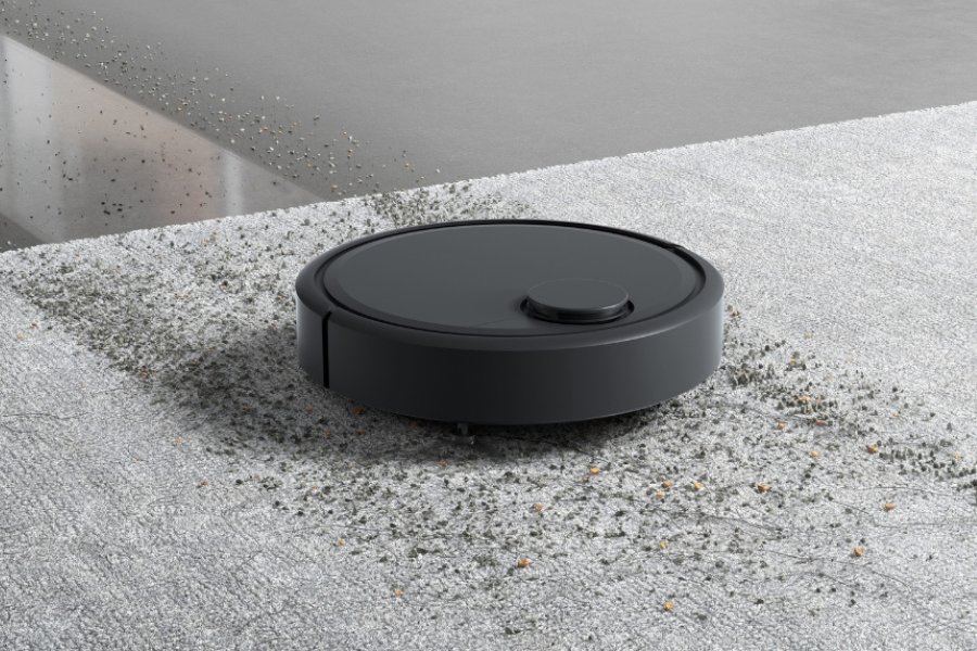 aspirateur robot deebot nettoyant des debris sur un tapis