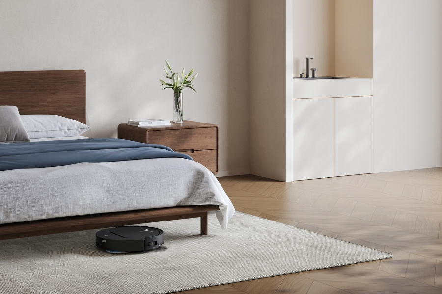 aspirateur robot deebot aspirant de la poussiere sous le lit