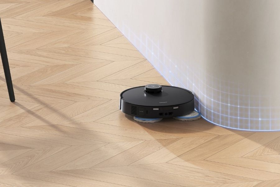 aspirateur robot laveur deebot nettoyant les coins d un parquet