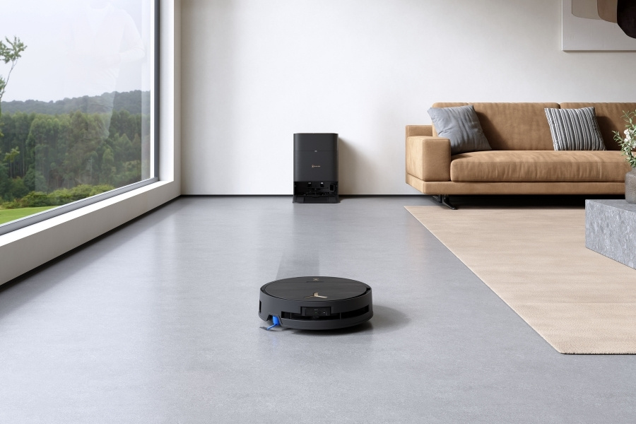 aspirateur robot deebot aspirant des carreaux dans le salon