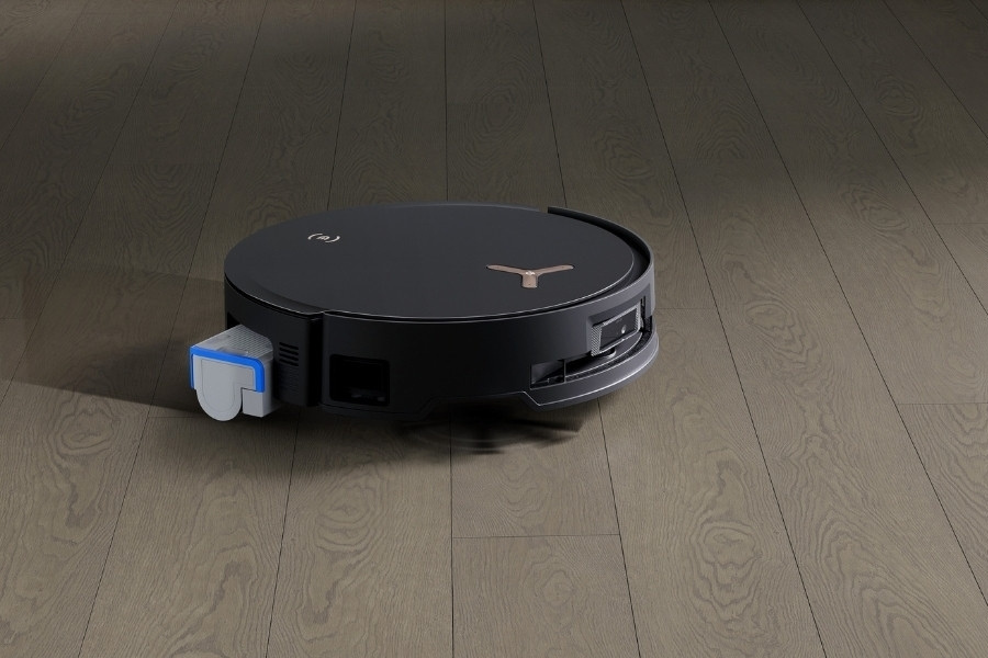 aspirateur robot deebot en train de nettoyer un parquet