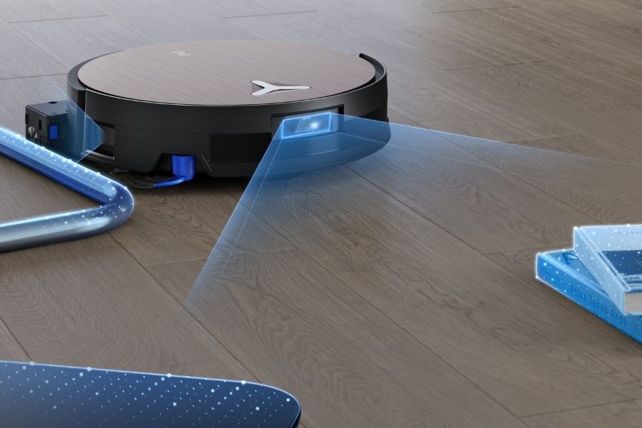 aspirateur robot deebot detectant des livres au sol