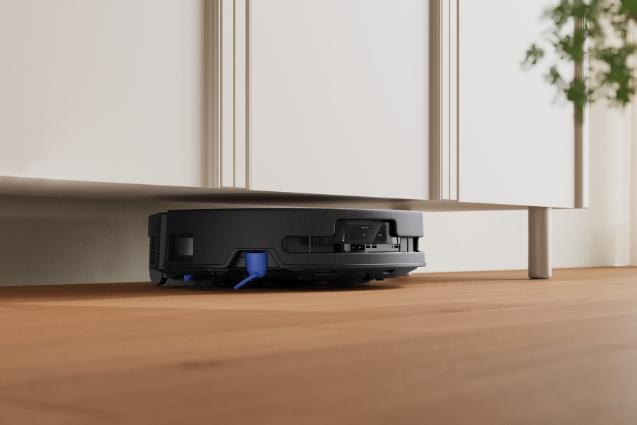 aspirateur robot deebot nettoyant sous un meuble