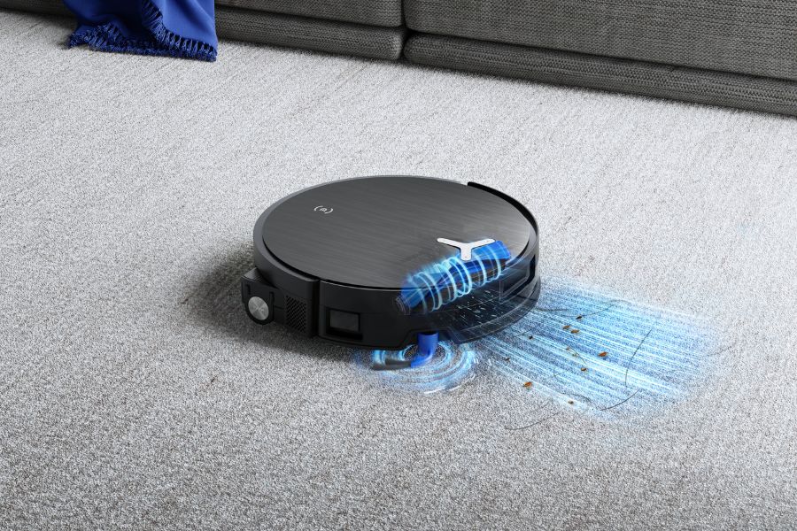 aspirateur robot deebot aspirant poussiere et poils sur un tapis