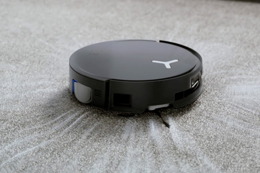 deebot robot vacuum cleaning on carpet