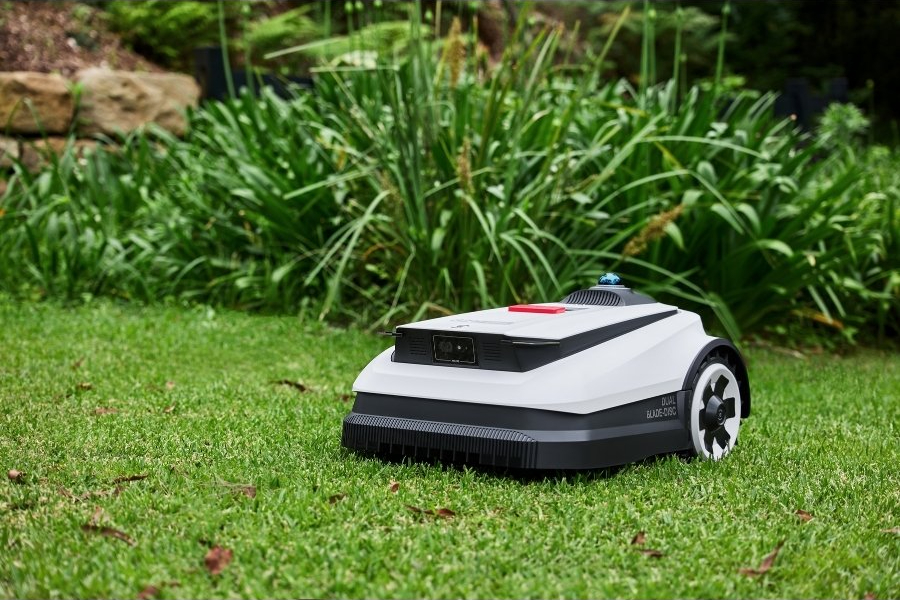 goat robot lawn mower navigating a small garden