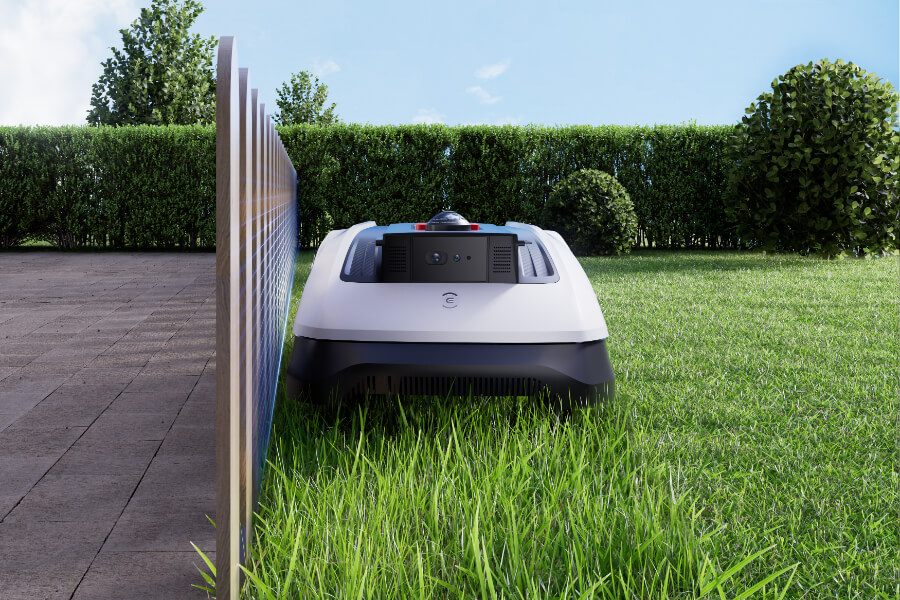 goat robot mower trimming a small lawn