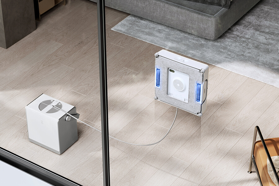 winbot robot window cleaner working on floor-to-ceiling glass panel