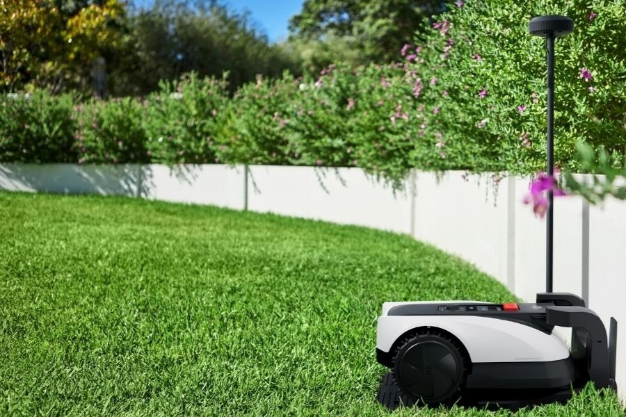 goat robot lawn mower charging at the station