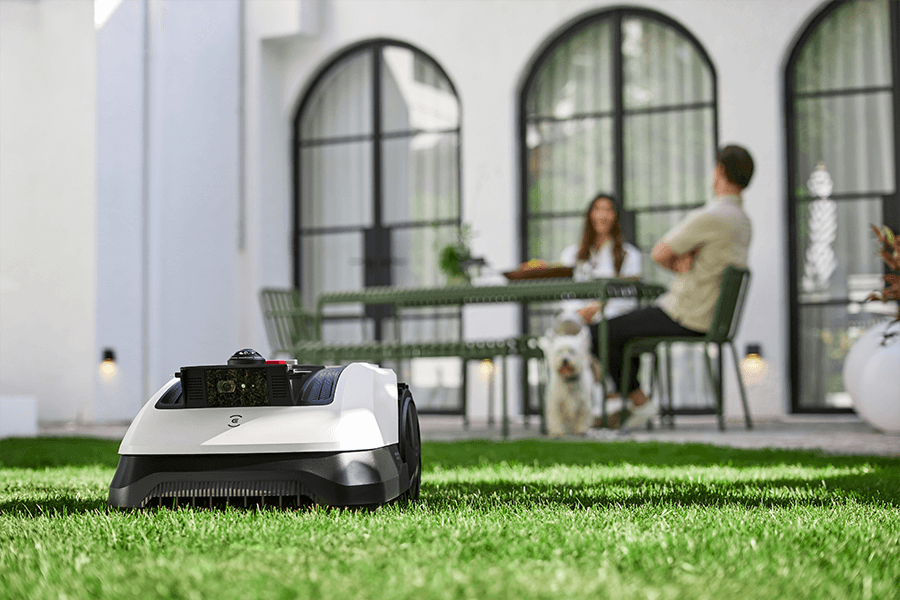 goat robot lawn mower navigating a small garden