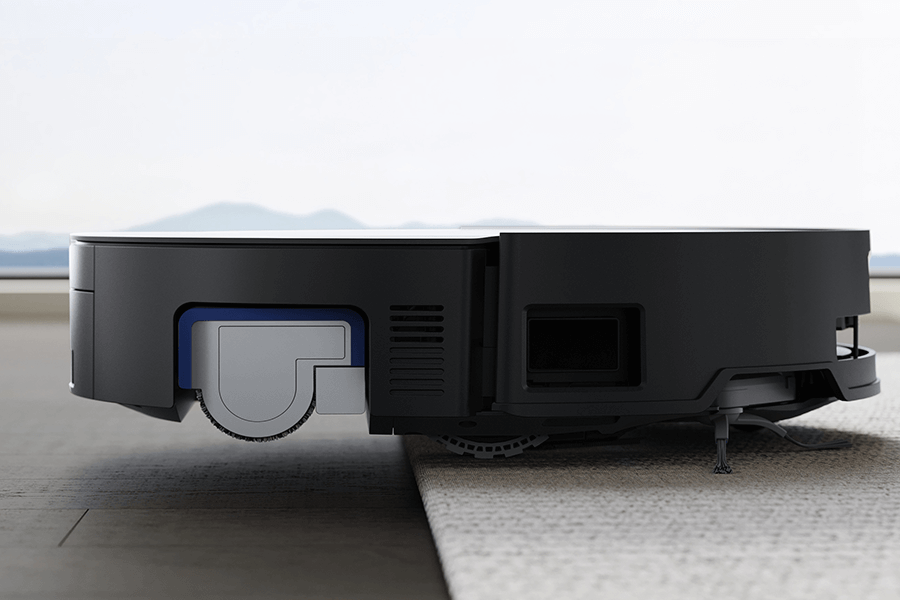 deebot robot vacuum cleaning a rug