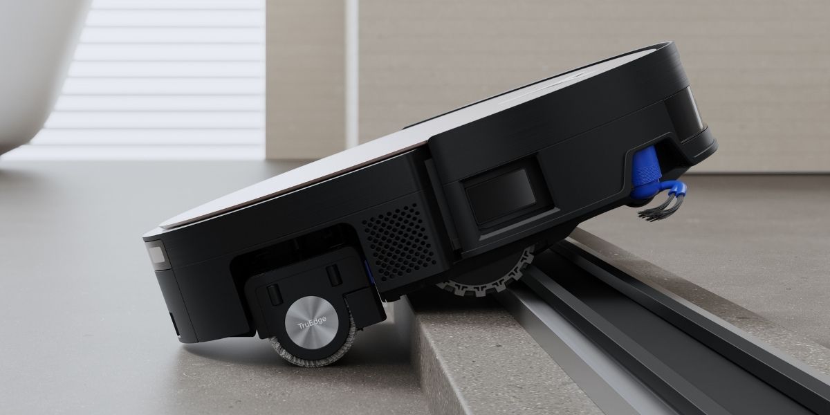 Robot vacuum navigating a threshold — clean sensors ensure accurate navigation