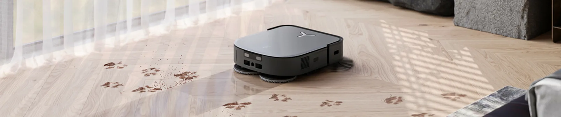 robot vacuum mopping paws and dirt from hardwood floor