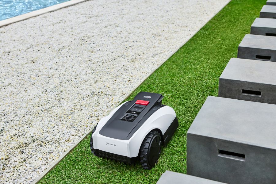 goat robot lawn mower mowing the edge of grass land