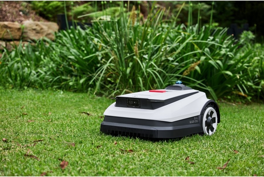 goat robot lawn mower navigating a small garden