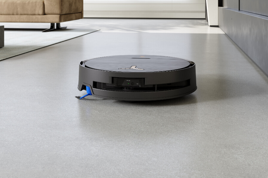 robot vacuum cleaner working on living room floor