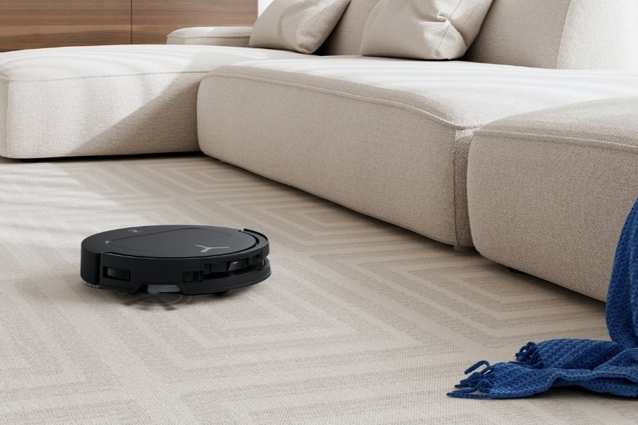 deebot robot vacuum vacuuming dust on carpet