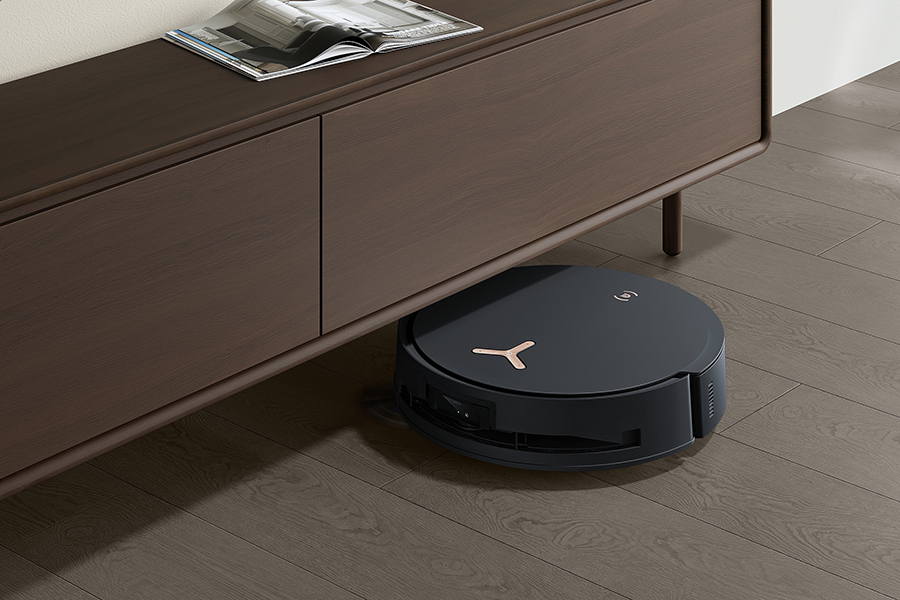 robot vacuum cleaner working in living room