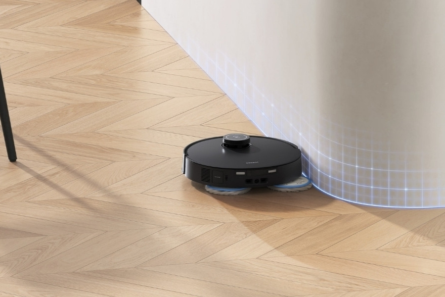 deebot robot vacuum cleaner cleaning edge of hardwood floor