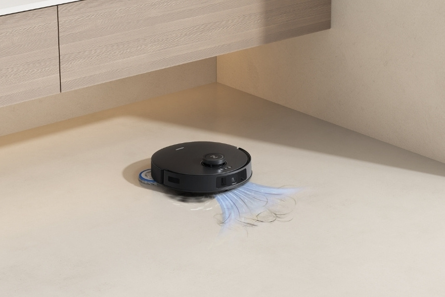 deebot robot vacuum vacuuming hair from tile floors in powder room