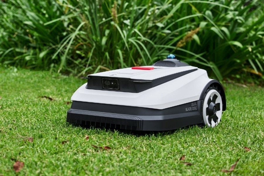 goat robot lawn mower cut grass in the morning