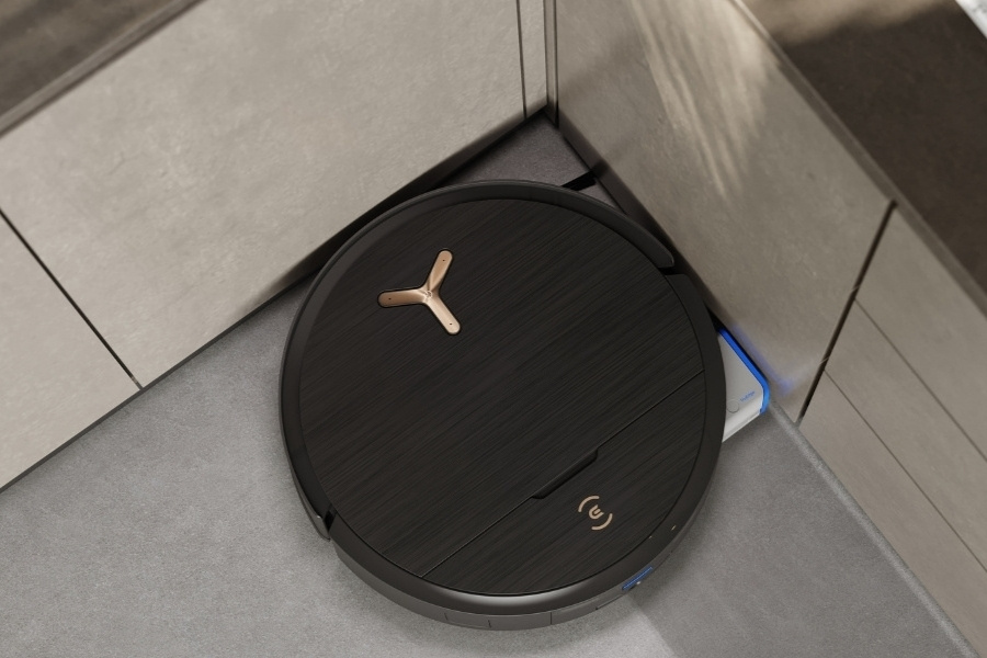 deebot robot vacuum cleaning kitchen corner