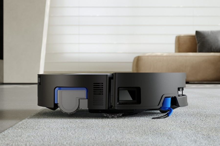 a close up of deebot robot vacuum lifting roller mop when cleaning carpet