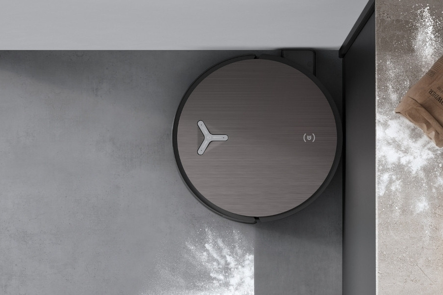 deebot robot vacuum cleaning flour on travertine floor