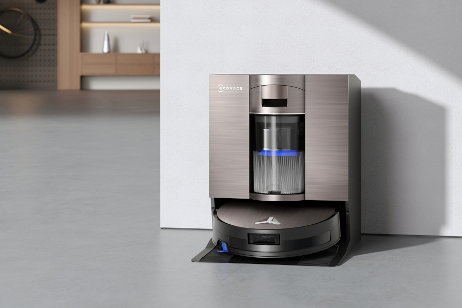 deebot robot vacuum self-cleaning at station after mopping tile floors