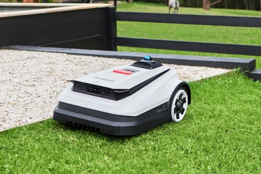 goat robot lawn mower mowing a garden