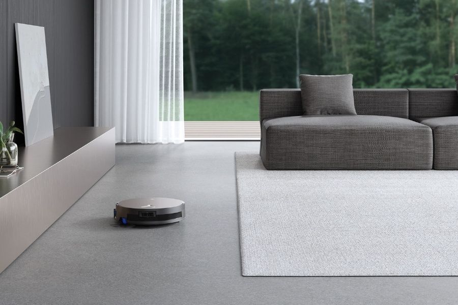 aspirateur robot Deebot nettoyant un sol en terrazzo dans le salon