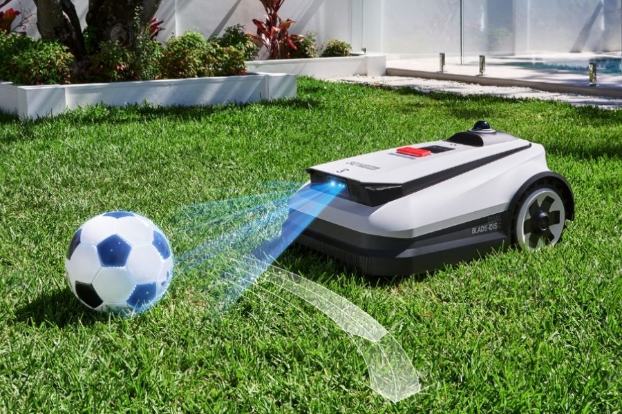 goat robot lawn mower detecting a football in the garden