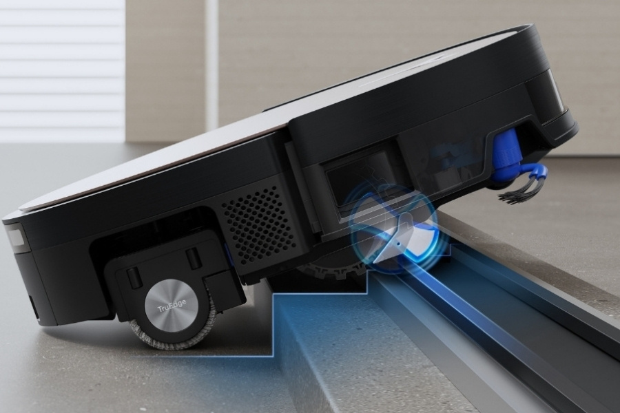 deebot robot vacuum climbing a threshold